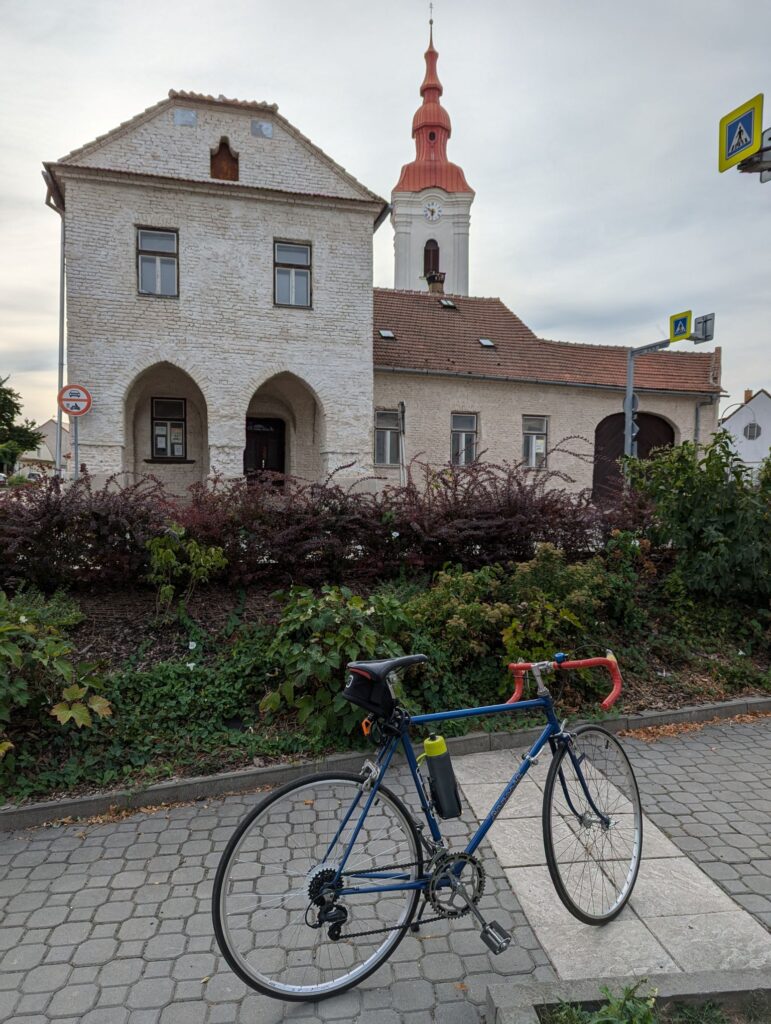 A Favorit road bike in front of a municipal building